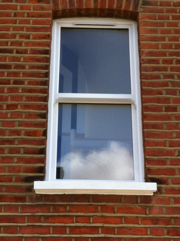uPVC sash window on Victorian red brick house in Reading